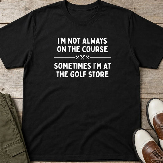 Golf Store T-Shirt in Black lying on a plain floor. T-shirt is a unisex cut and 100 per cent cotton.