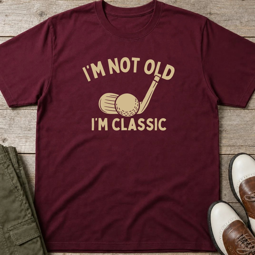 I'm Classic T-Shirt in Maroon lying on a plain floor. T-shirt is a unisex cut and 100 per cent cotton.