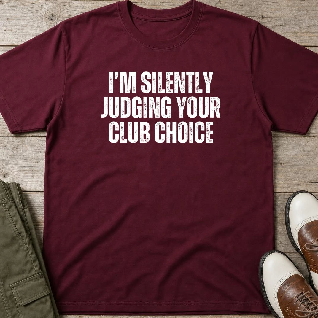 Silently Judging T-Shirt in Maroon lying on a plain floor. T-shirt is a unisex cut and 100 per cent cotton.