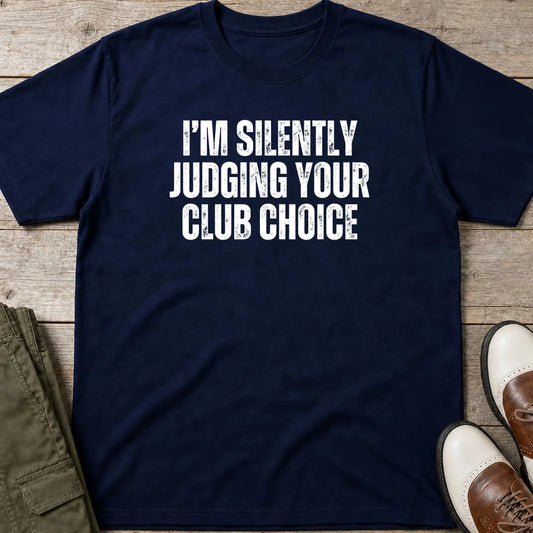 Silently Judging T-Shirt in Navy lying on a plain floor. T-shirt is a unisex cut and 100 per cent cotton.