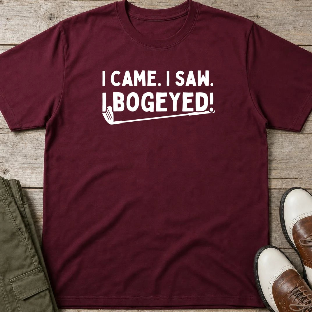 Bogeyed T-Shirt in Maroon lying on a plain floor. T-shirt is a unisex cut and 100 per cent cotton.