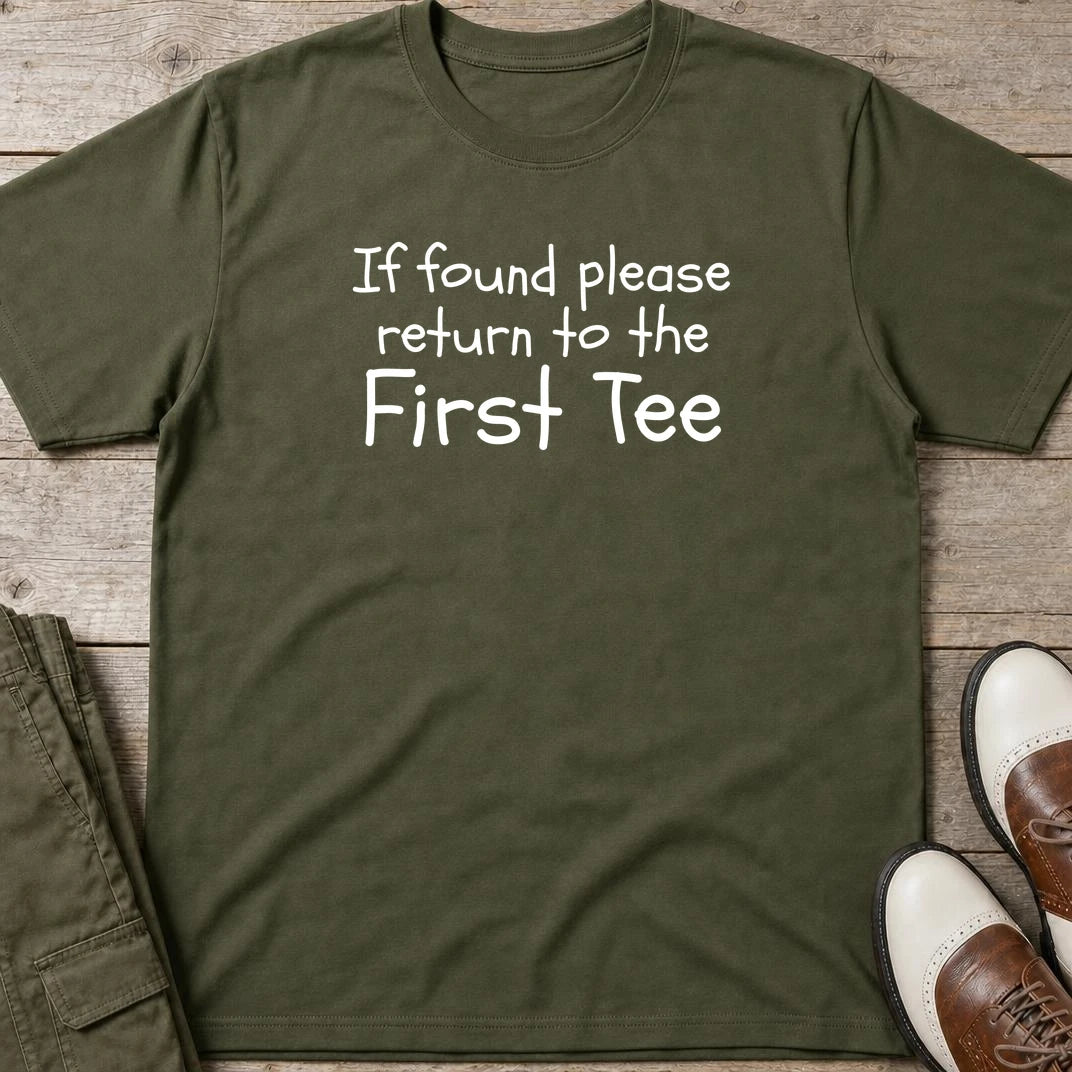 If Found Please Return T-Shirt in Military Green lying on a plain floor. T-shirt is a unisex cut and 100 per cent cotton.