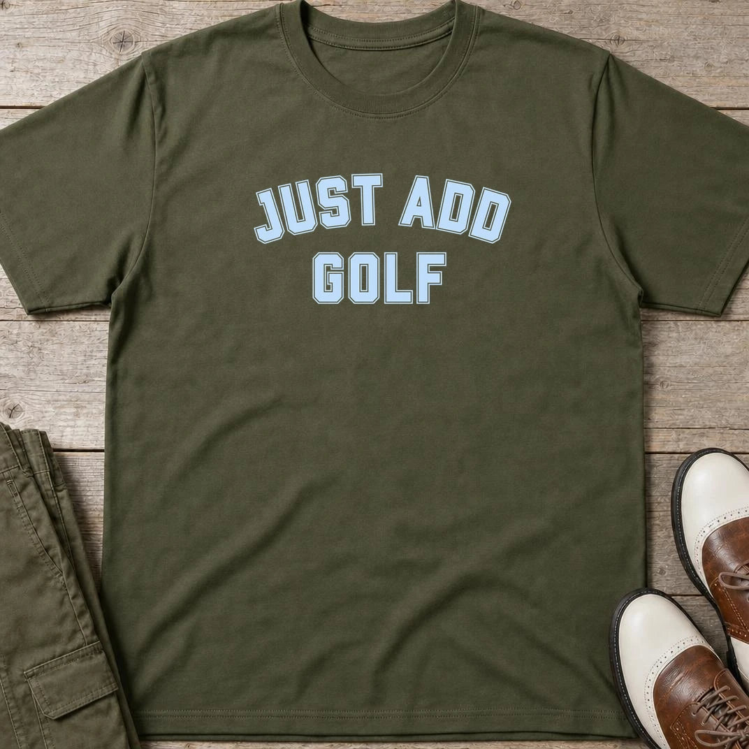 Just Add Golf T-Shirt in Military Green lying on a plain floor. T-shirt is a unisex cut and 100 per cent cotton.