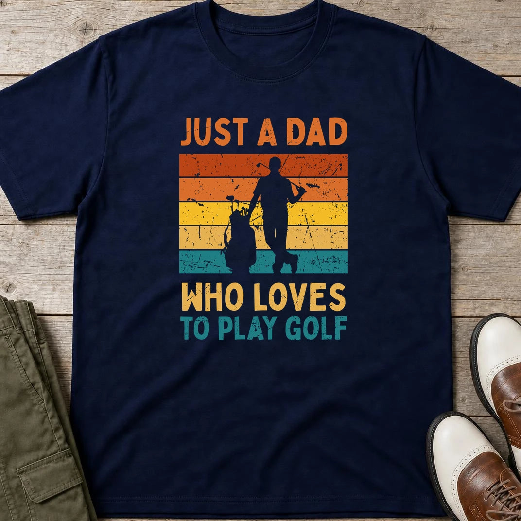 Just A Dad T-Shirt in Navy lying on a plain floor. T-shirt is a unisex cut and 100 per cent cotton.