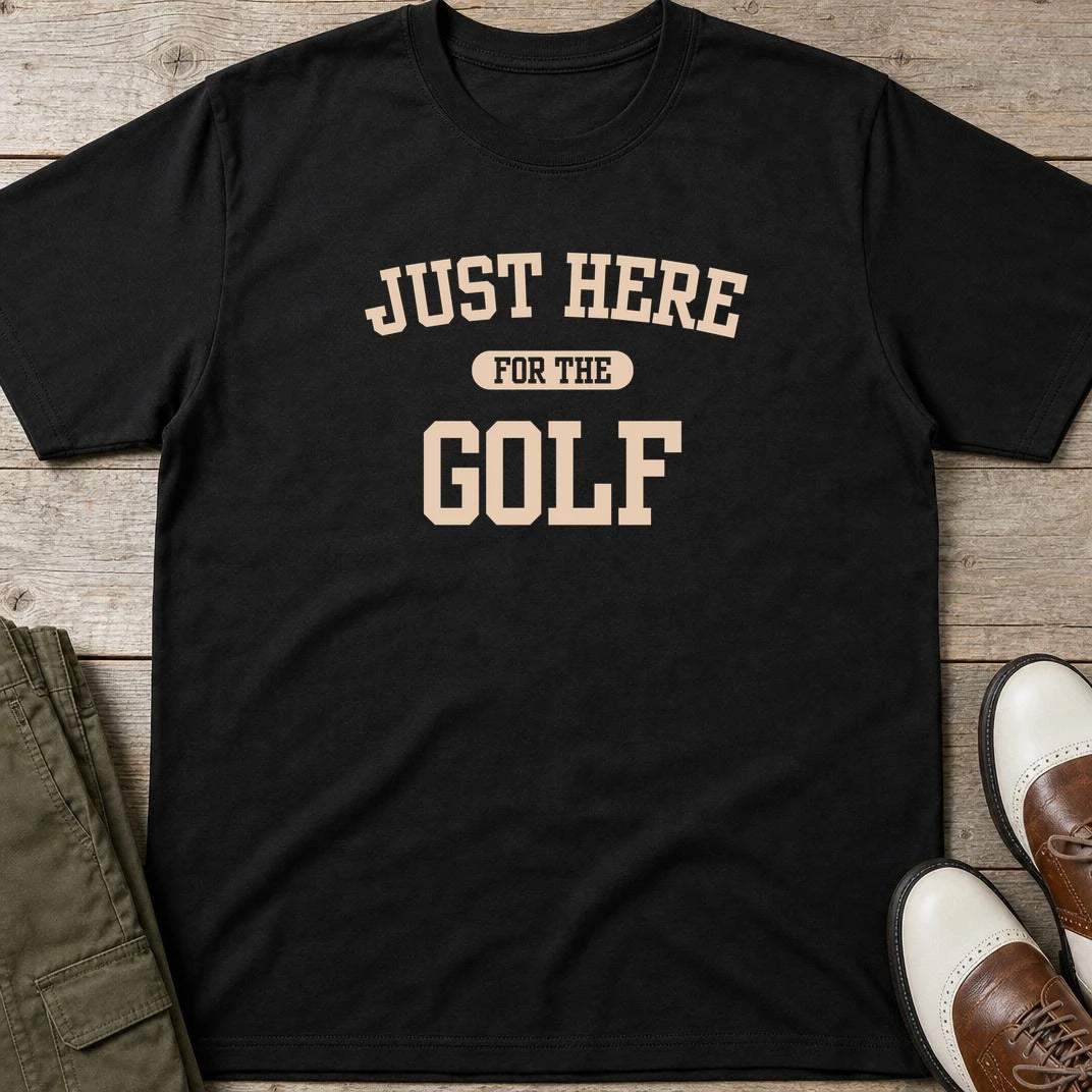 Just Here T-Shirt in Black lying on a plain floor. T-shirt is a unisex cut and 100 per cent cotton.
