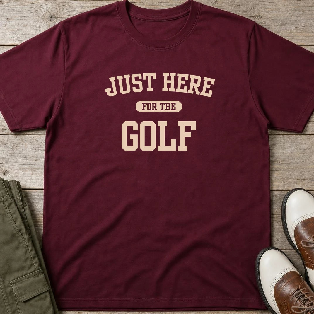 Just Here T-Shirt in Maroon lying on a plain floor. T-shirt is a unisex cut and 100 per cent cotton.
