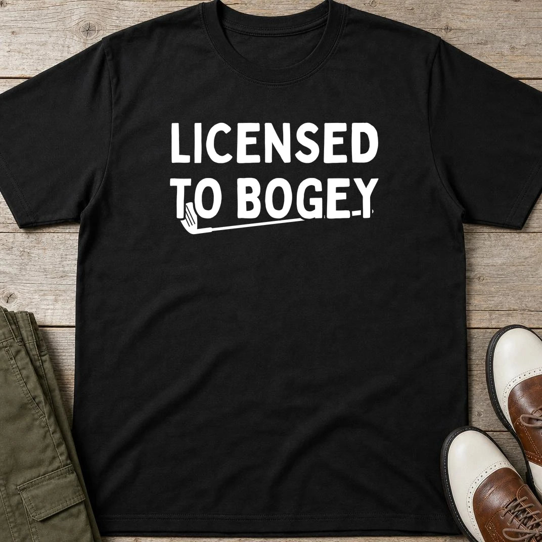 Licensed T-Shirt in Black lying on a plain floor. T-shirt is a unisex cut and 100 per cent cotton.