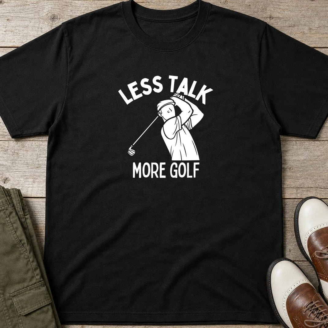 Less Talk T-Shirt in Black lying on a plain floor. T-shirt is a unisex cut and 100 per cent cotton.