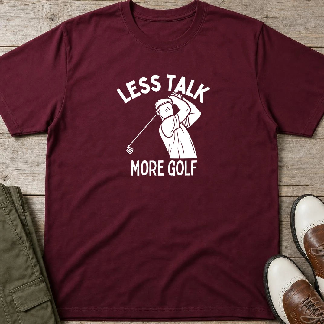 Less Talk T-Shirt in Maroon lying on a plain floor. T-shirt is a unisex cut and 100 per cent cotton.