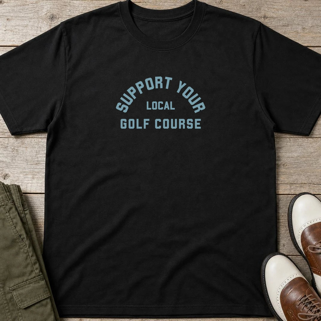 Local Golf Course T-Shirt in Black lying on a plain floor. T-shirt is a unisex cut and 100 per cent cotton.