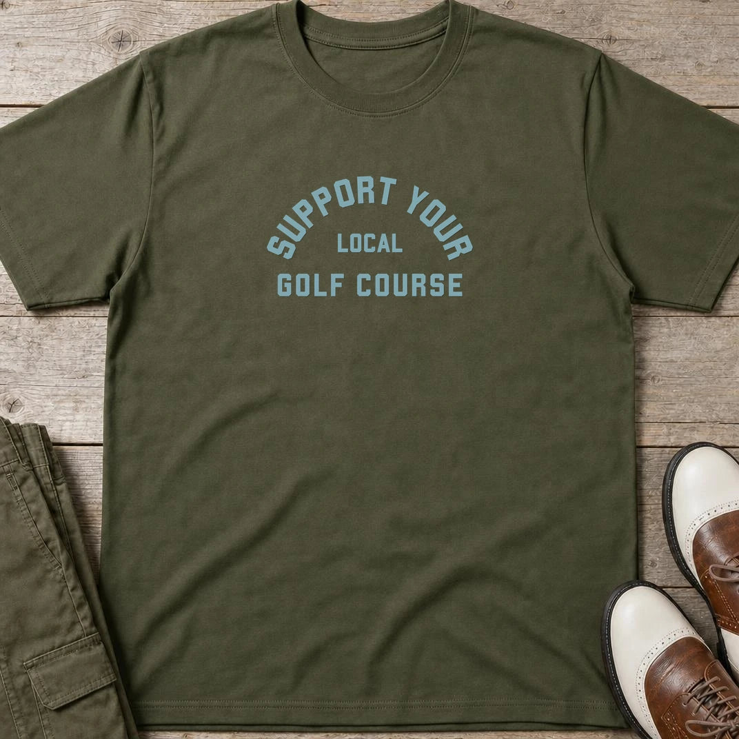 Local Golf Course T-Shirt in Military Green lying on a plain floor. T-shirt is a unisex cut and 100 per cent cotton.