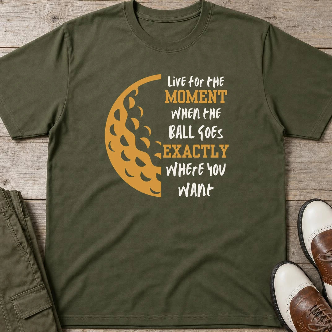 The Moment T-Shirt in Military Green lying on a plain floor. T-shirt is a unisex cut and 100 per cent cotton.