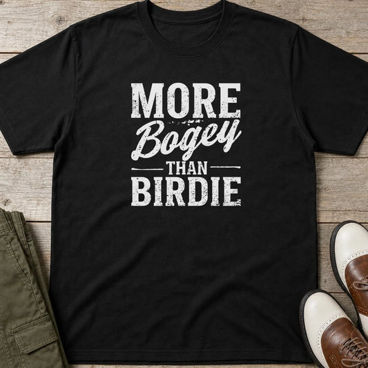 More Bogey T-Shirt in Black lying on a plain floor. T-shirt is a unisex cut and 100 per cent cotton.