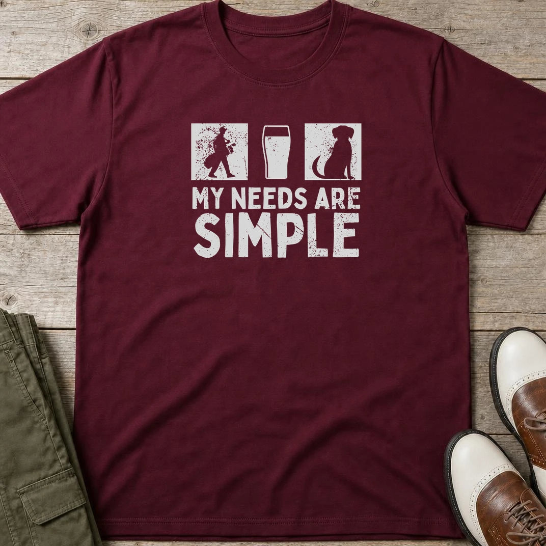 Simple T-Shirt in Maroon lying on a plain floor. T-shirt is a unisex cut and 100 per cent cotton.