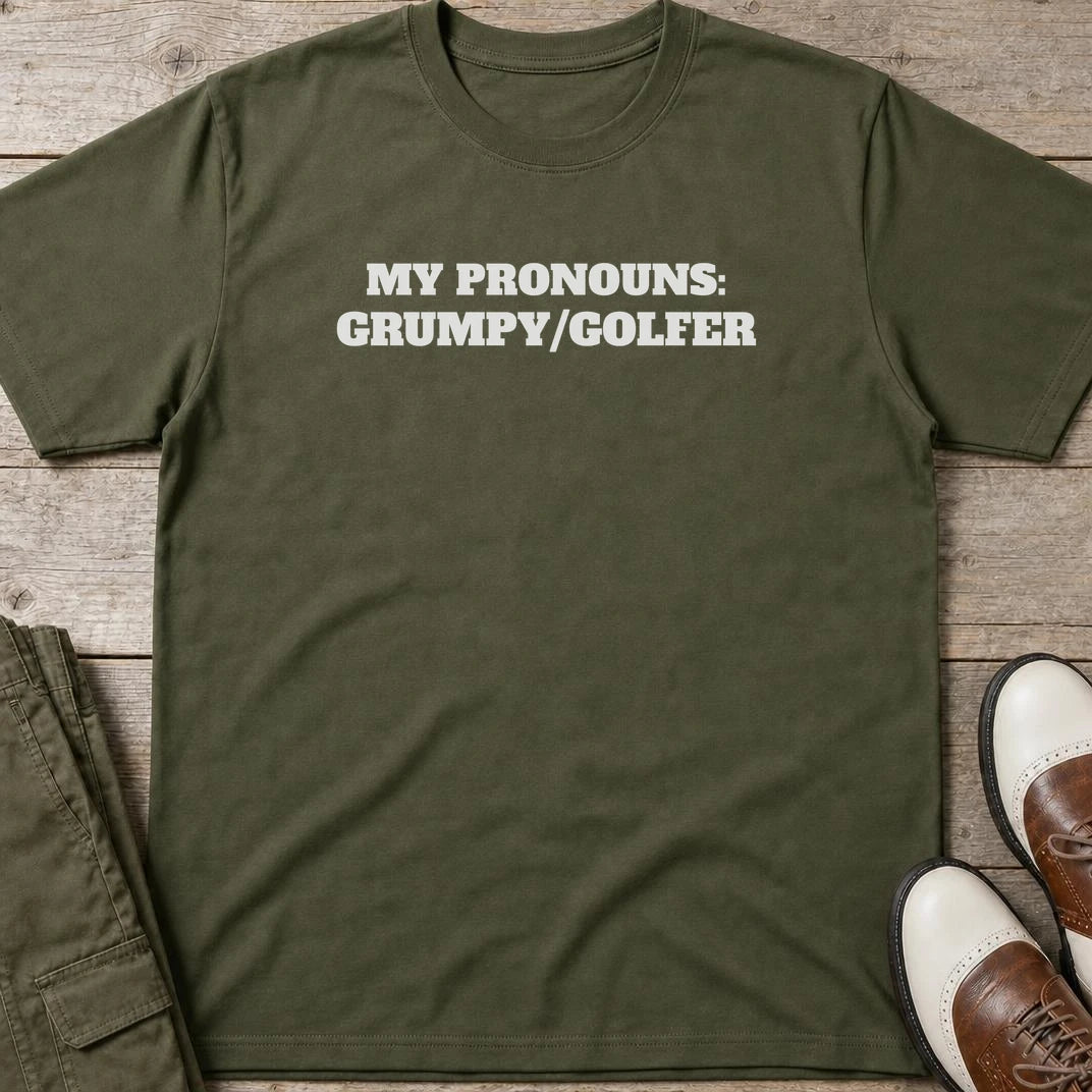 My Pronouns T-Shirt in Military Green lying on a plain floor. T-shirt is a unisex cut and 100 per cent cotton.