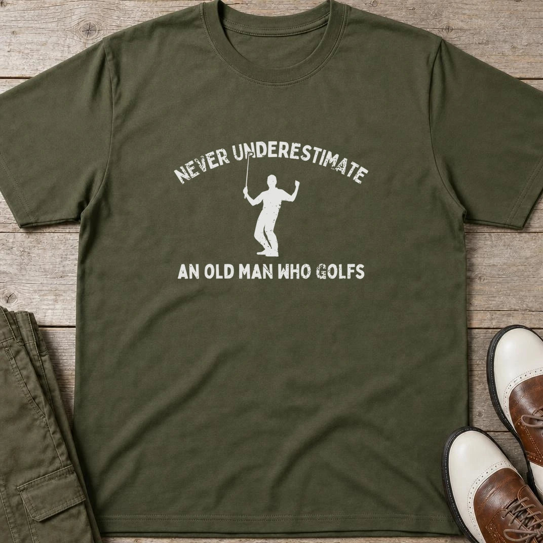Old Man T-Shirt in Military Green lying on a plain floor. T-shirt is a unisex cut and 100 per cent cotton.