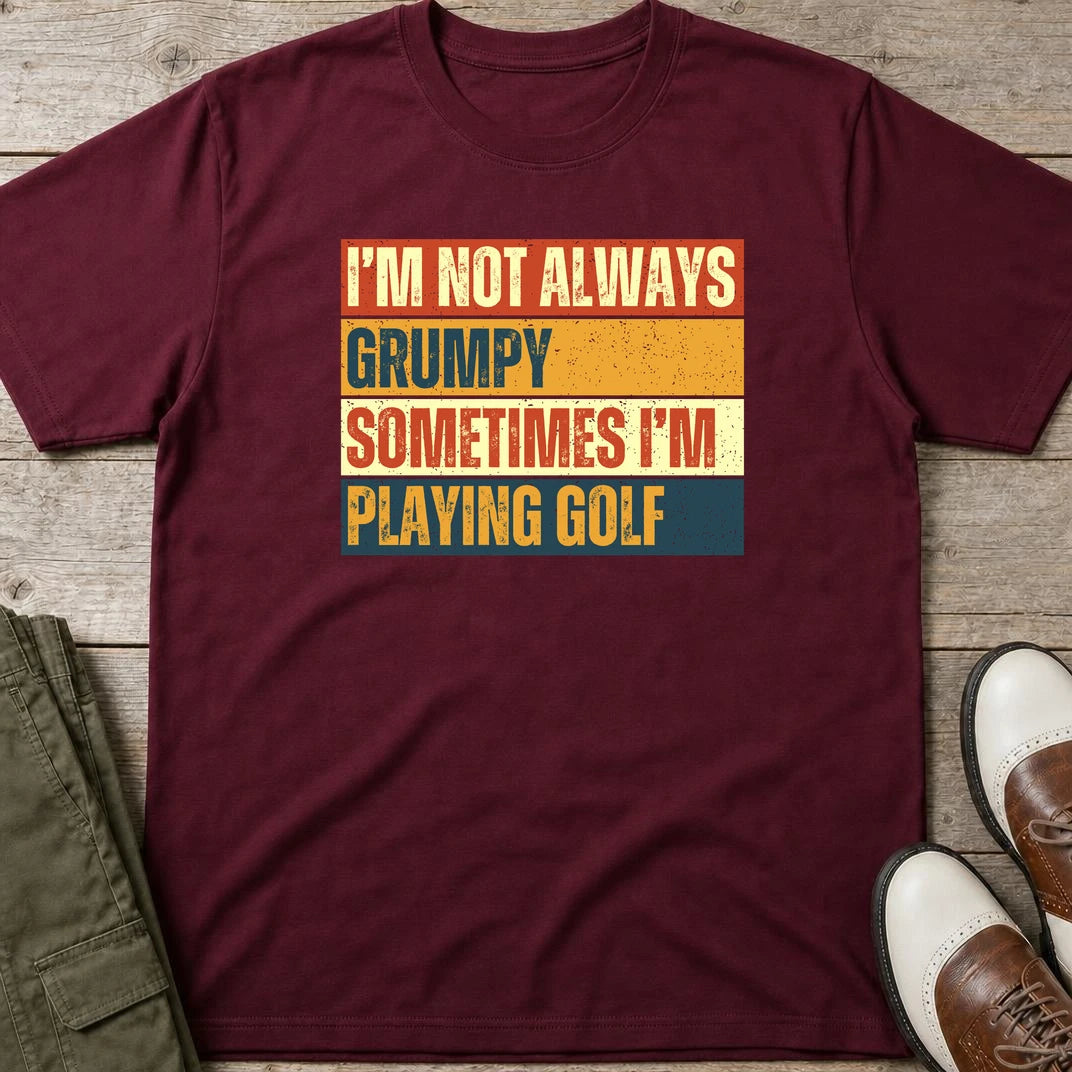 Grumpy Vintage T-Shirt in Maroon lying on a plain floor. T-shirt is a unisex cut and 100 per cent cotton.