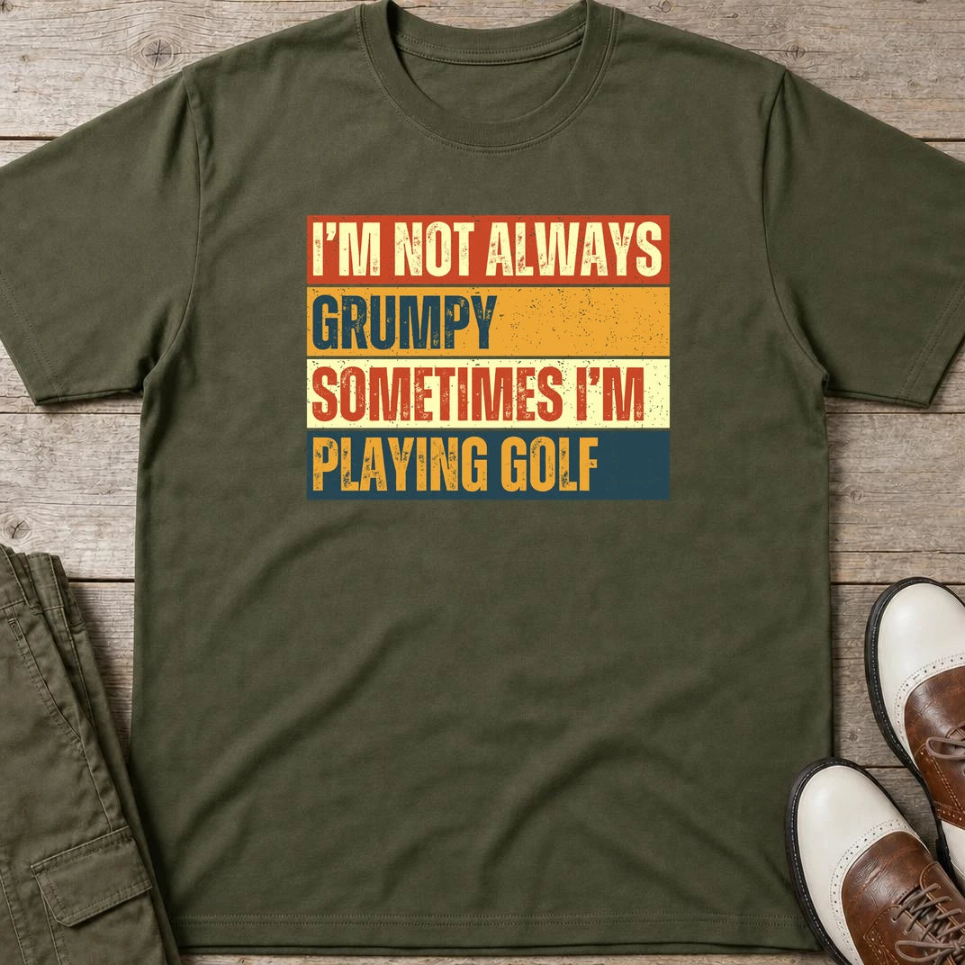 Grumpy Vintage T-Shirt in Military Green lying on a plain floor. T-shirt is a unisex cut and 100 per cent cotton.