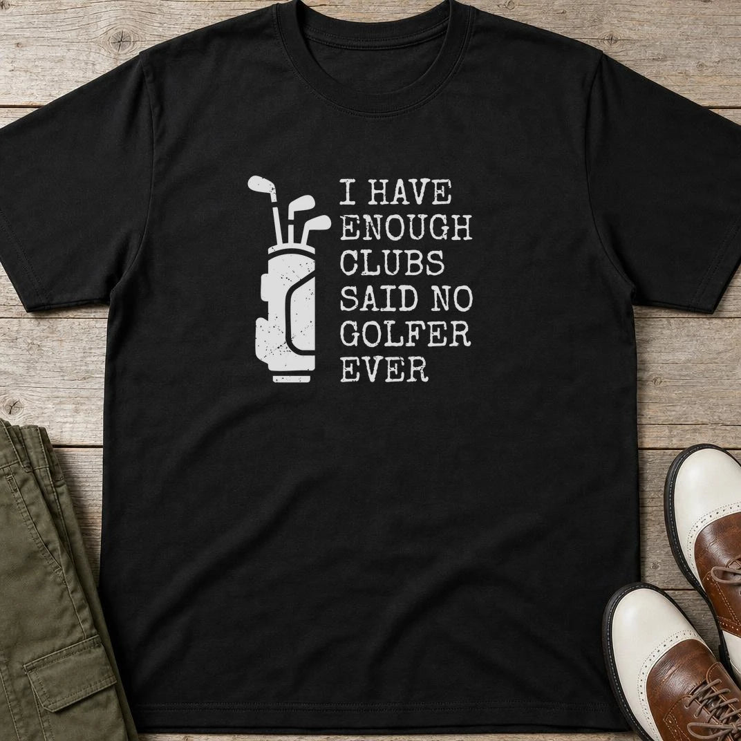 Enough Clubs T-Shirt in Black lying on a plain floor. T-shirt is a unisex cut and 100 per cent cotton.