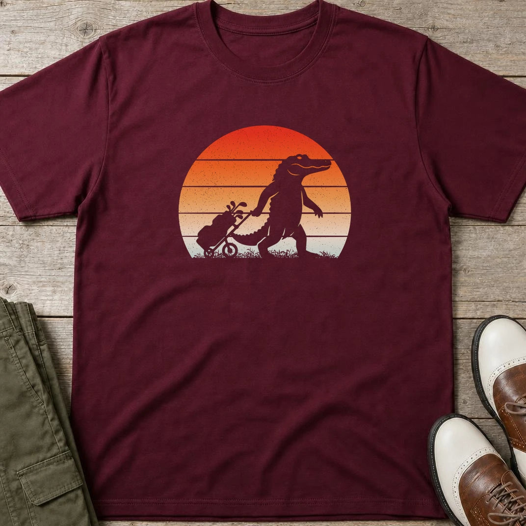 Trolley Gator T-Shirt in Maroon lying on a plain floor. T-shirt is a unisex cut and 100 per cent cotton.