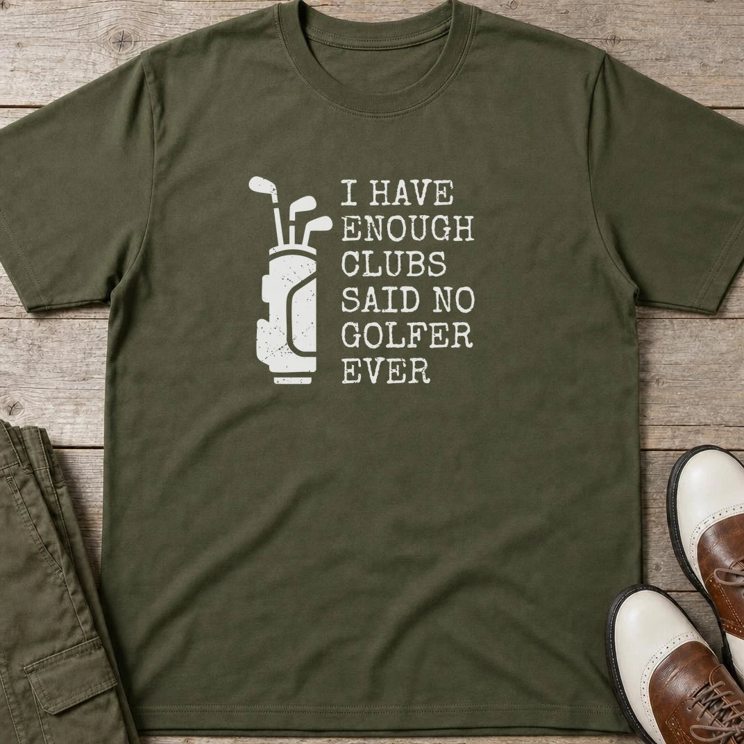 Enough Clubs T-Shirt in Military Green lying on a plain floor. T-shirt is a unisex cut and 100 per cent cotton.
