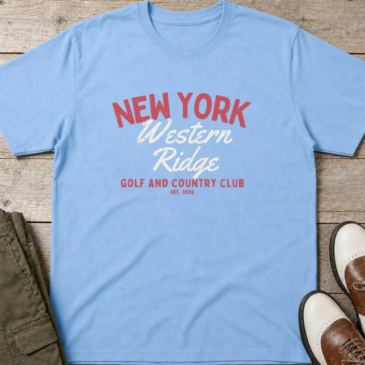 Western Ridge T-Shirt in Light Blue lying on a plain floor. T-shirt is a unisex cut and 100 per cent cotton.