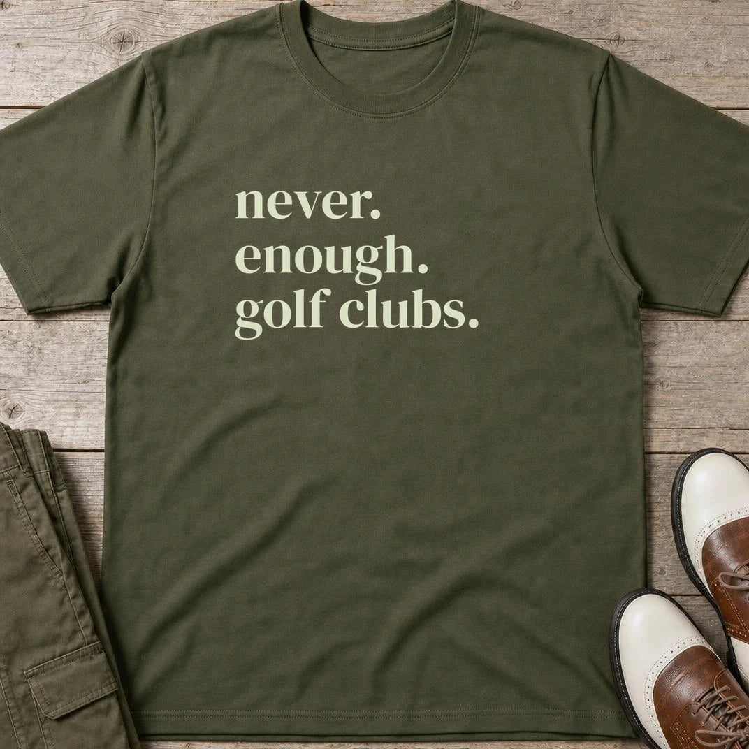 Never Enough T-Shirt in Military Green lying on a plain floor. T-shirt is a unisex cut and 100 per cent cotton.