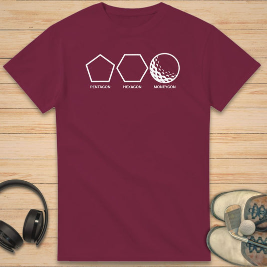 Moneygon T-Shirt in Maroon on a light wooden floor lying next to headphones and golf shoes.