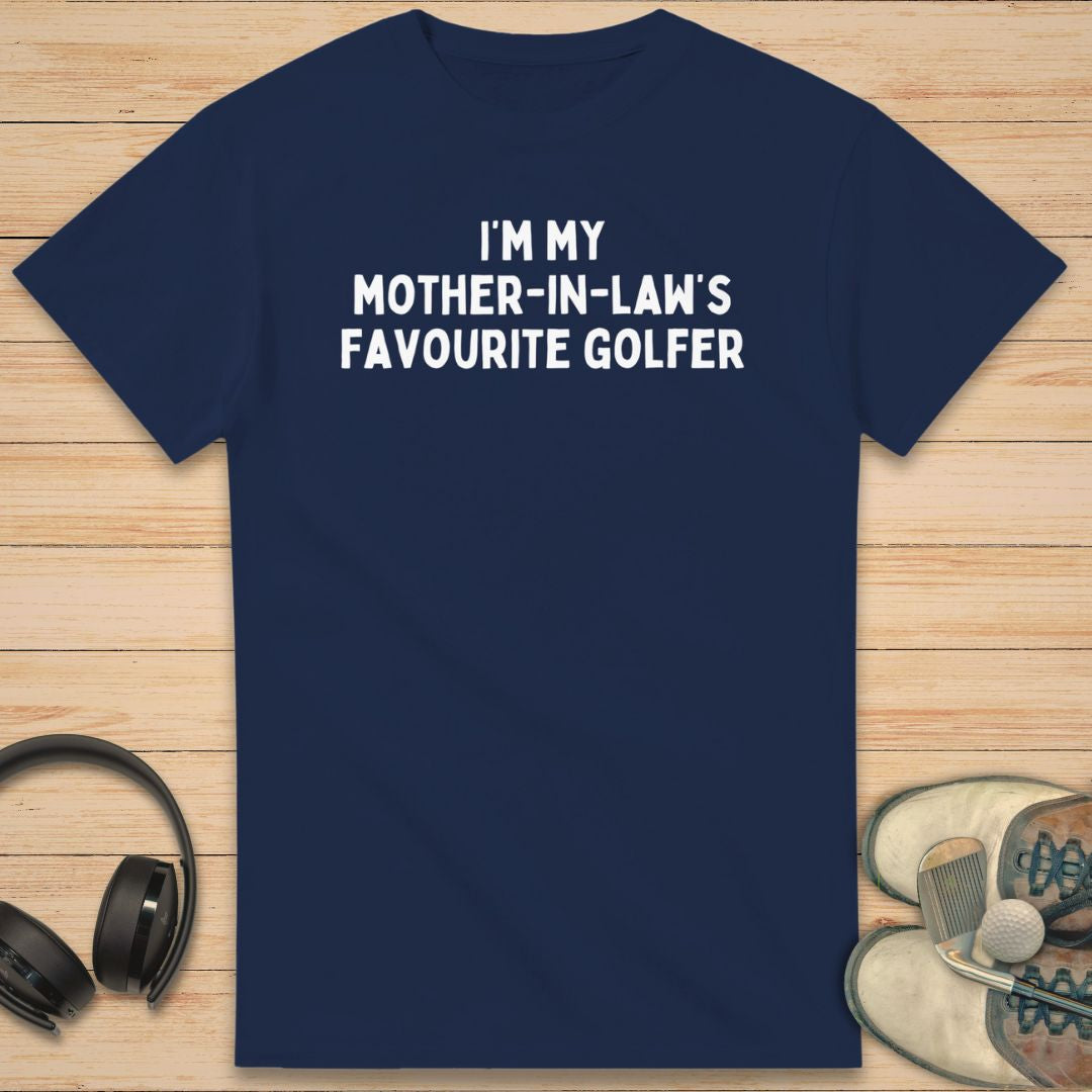 Mother-In-Law T-Shirt in Navy on a light wooden floor lying next to headphones and golf shoes.