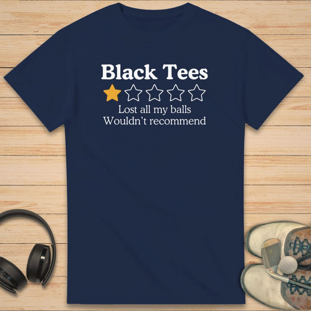 Black Tees T-Shirt in Navy on a light wooden floor lying next to headphones and golf shoes.