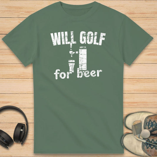 For Beer T-Shirt in Military Green on a light wooden floor lying next to headphones and golf shoes.