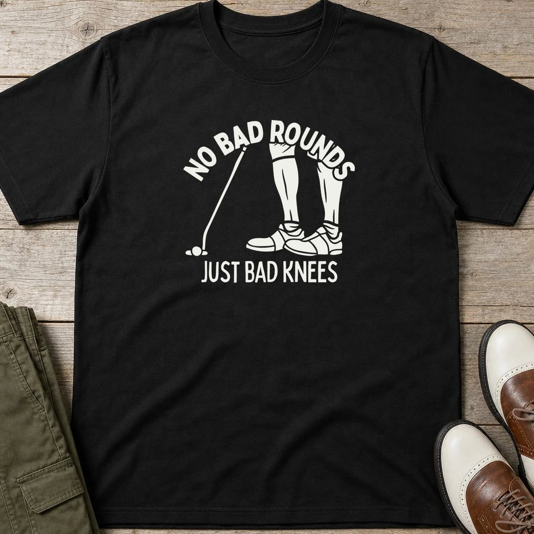 No Bad Rounds T-Shirt in Black lying on a plain floor. T-shirt is a unisex cut and 100 per cent cotton.