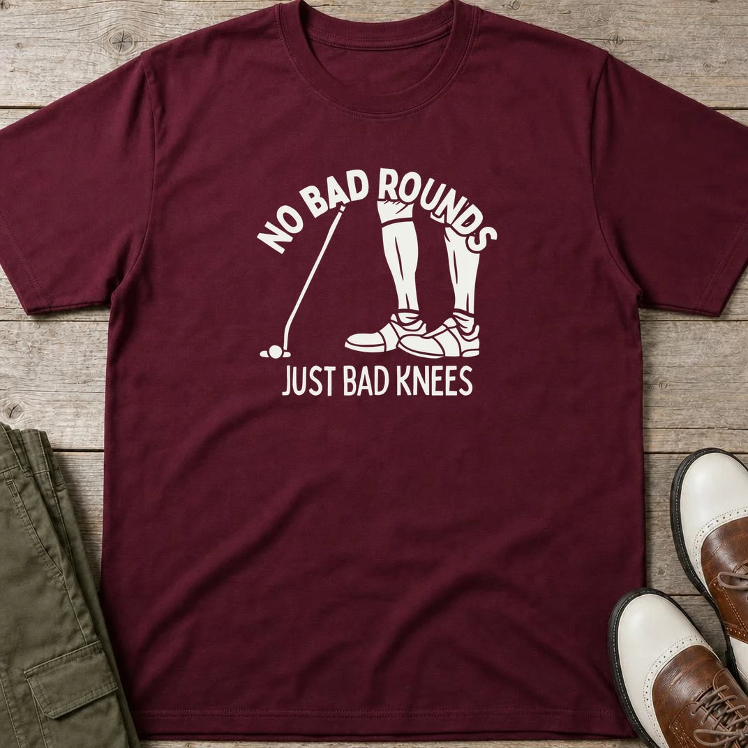 No Bad Rounds T-Shirt in Maroon lying on a plain floor. T-shirt is a unisex cut and 100 per cent cotton.