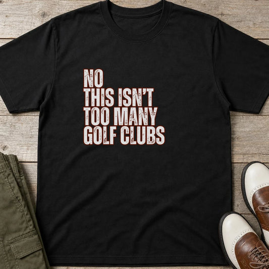 Too Many T-Shirt in Black lying on a plain floor. T-shirt is a unisex cut and 100 per cent cotton.