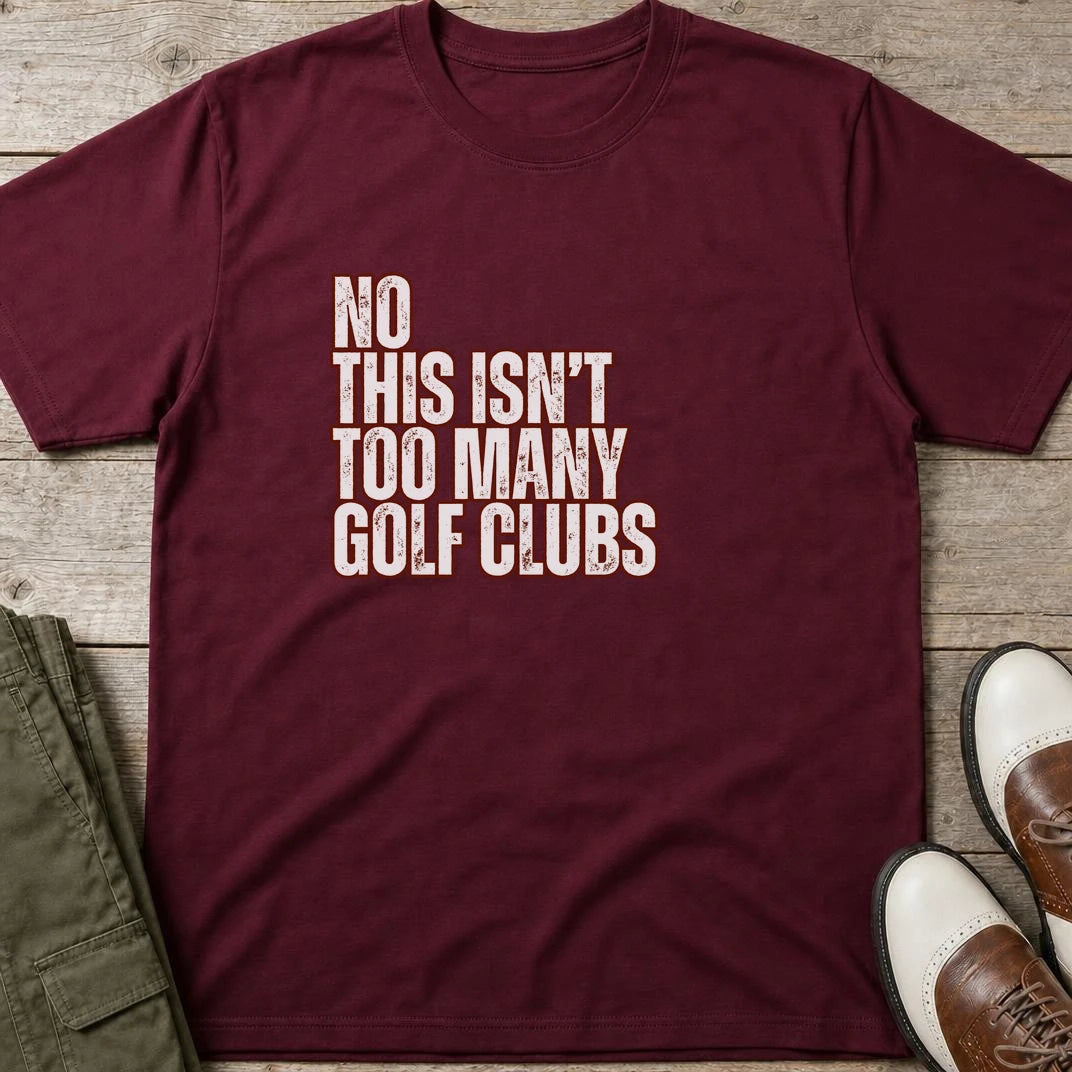 Too Many T-Shirt in Maroon lying on a plain floor. T-shirt is a unisex cut and 100 per cent cotton.