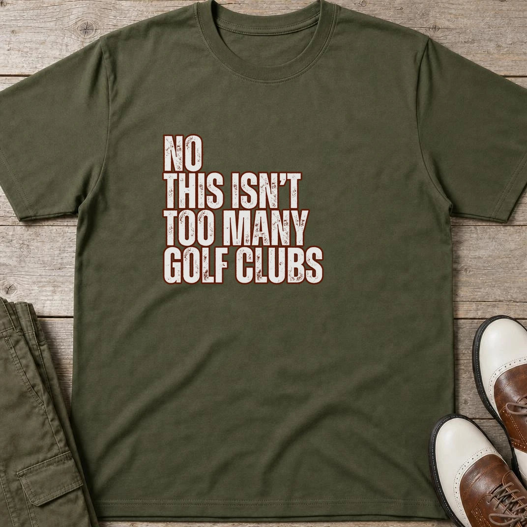 Too Many T-Shirt in Military Green lying on a plain floor. T-shirt is a unisex cut and 100 per cent cotton.