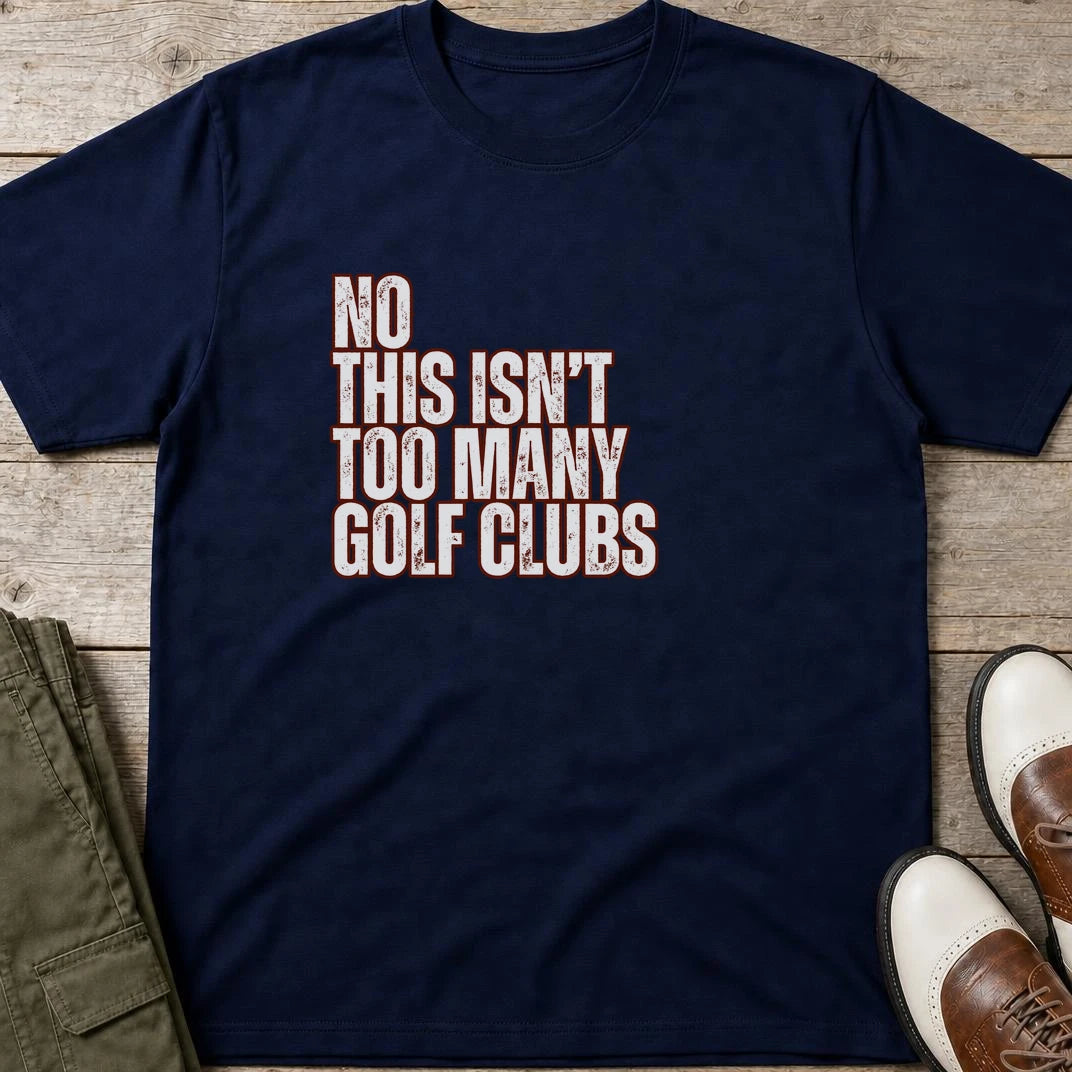 Too Many T-Shirt in Navy lying on a plain floor. T-shirt is a unisex cut and 100 per cent cotton.