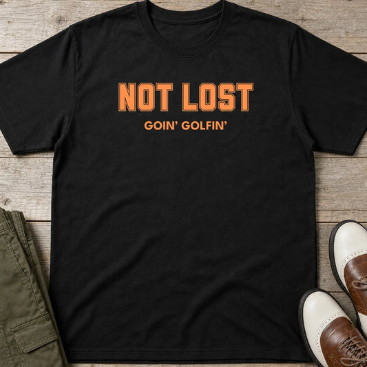 Not Lost T-Shirt in Black lying on a plain floor. T-shirt is a unisex cut and 100 per cent cotton.