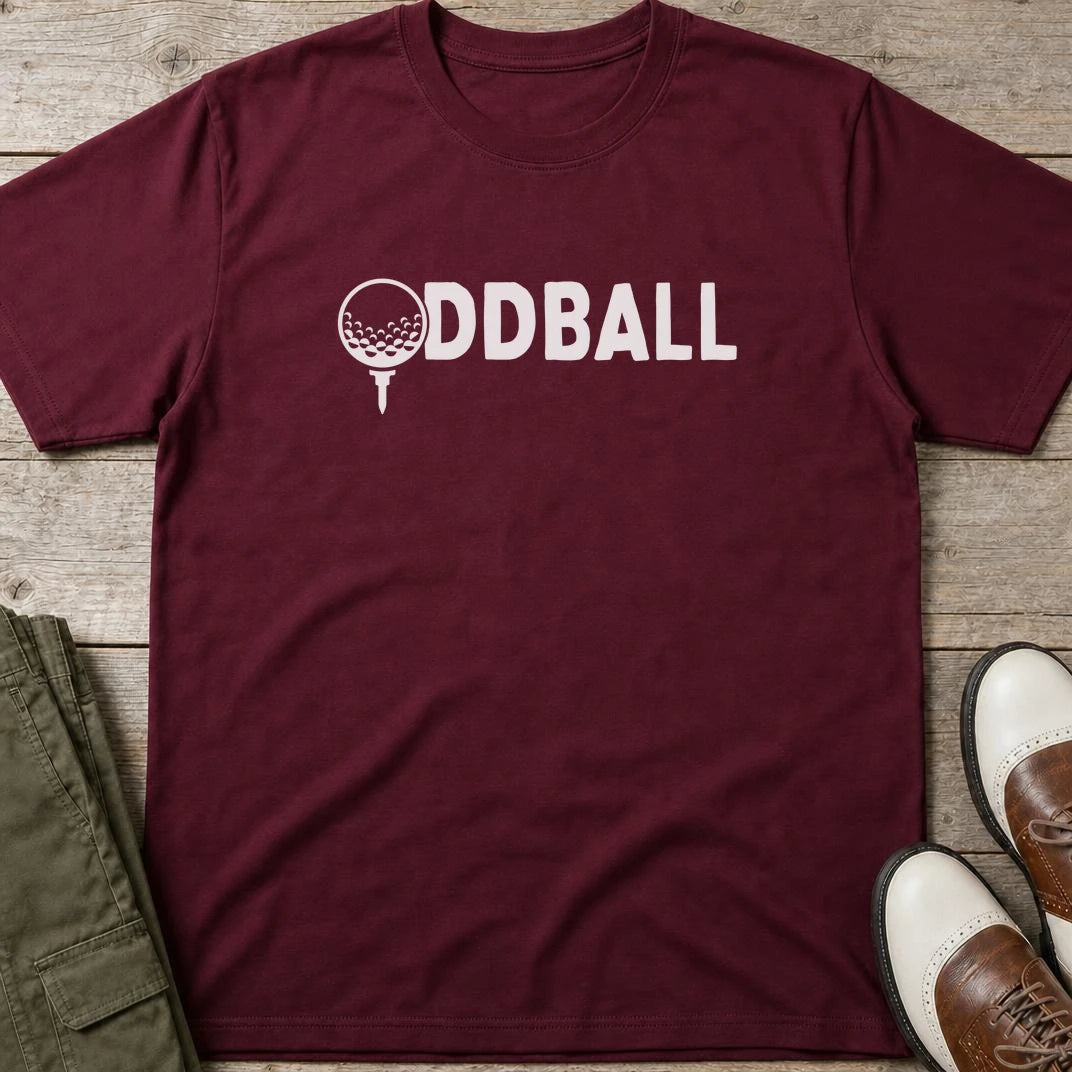 Oddball T-Shirt in Maroon lying on a plain floor. T-shirt is a unisex cut and 100 per cent cotton.
