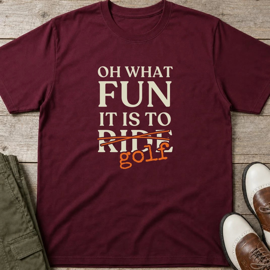 Oh What Fun T-Shirt in Maroon lying on a plain floor. T-shirt is a unisex cut and 100 per cent cotton.