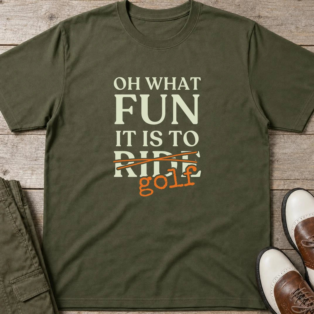 Oh What Fun T-Shirt in Military Green lying on a plain floor. T-shirt is a unisex cut and 100 per cent cotton.