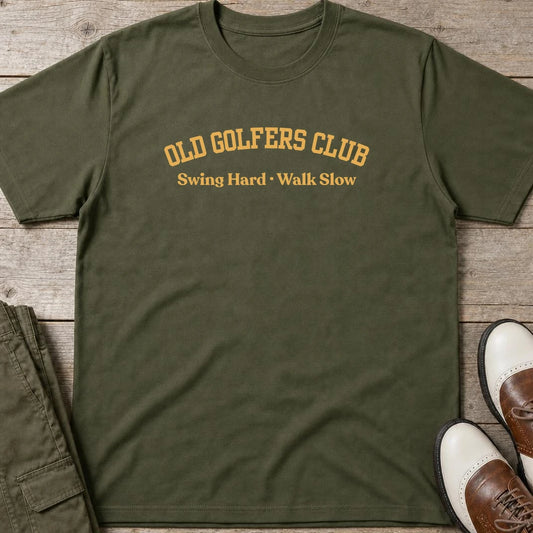 Old Golfers T-Shirt in Military Green lying on a plain floor. T-shirt is a unisex cut and 100 per cent cotton.