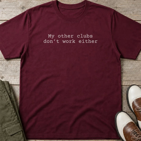 My Other Clubs T-Shirt in Maroon lying on a plain floor. T-shirt is a unisex cut and 100 per cent cotton.