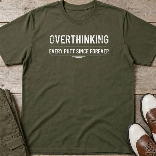 Every Putt T-Shirt in Military Green lying on a plain floor. T-shirt is a unisex cut and 100 per cent cotton.