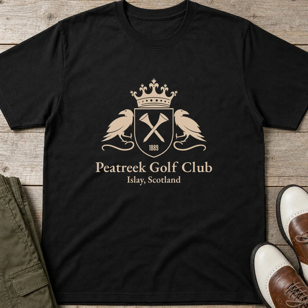 Peatreek GC T-Shirt in Black lying on a plain floor. T-shirt is a unisex cut and 100 per cent cotton.