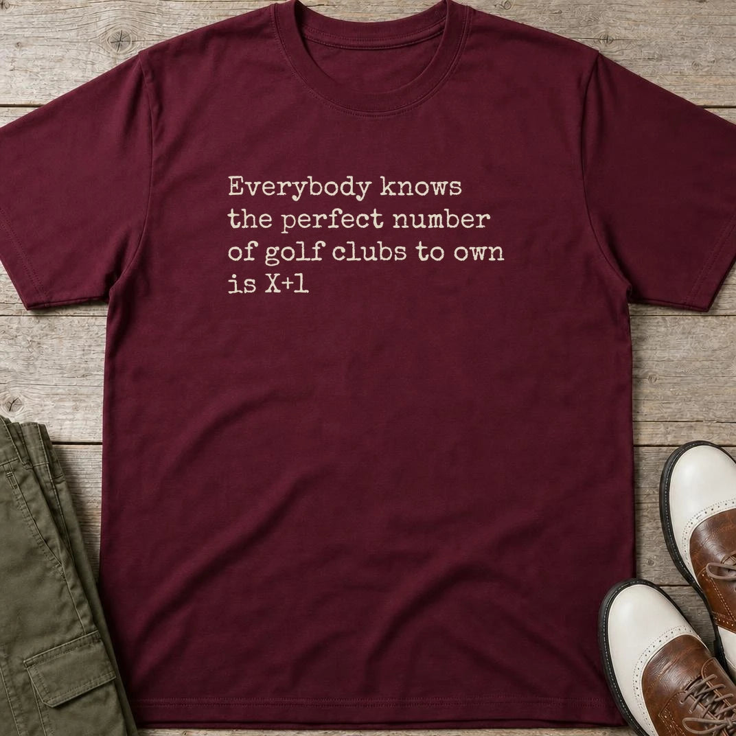 The Perfect Number T-Shirt in Maroon lying on a plain floor. T-shirt is a unisex cut and 100 per cent cotton.