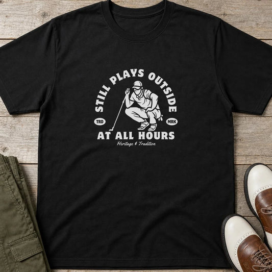 At All Hours T-Shirt in Black lying on a plain floor. T-shirt is a unisex cut and 100 per cent cotton.