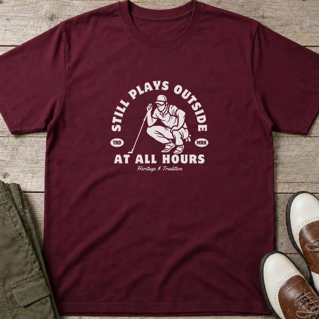 At All Hours T-Shirt in Maroon lying on a plain floor. T-shirt is a unisex cut and 100 per cent cotton.