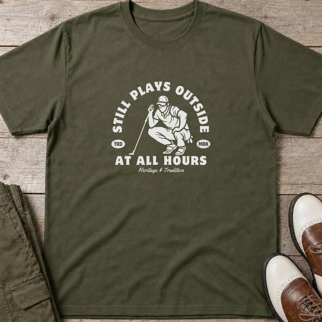 At All Hours T-Shirt in Military Green lying on a plain floor. T-shirt is a unisex cut and 100 per cent cotton.