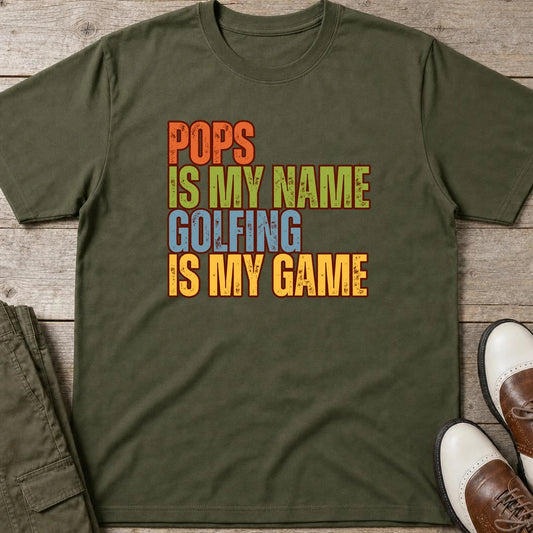 Pops My Name T-Shirt in Military Green lying on a plain floor. T-shirt is a unisex cut and 100 per cent cotton.